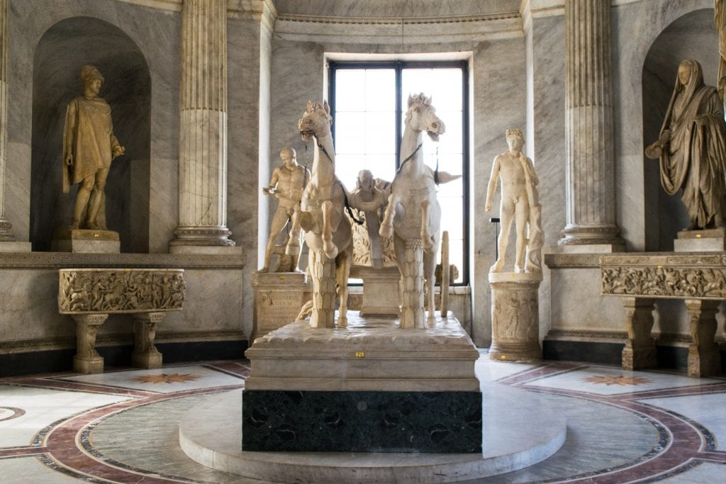 marble statues on display in the vatican museums