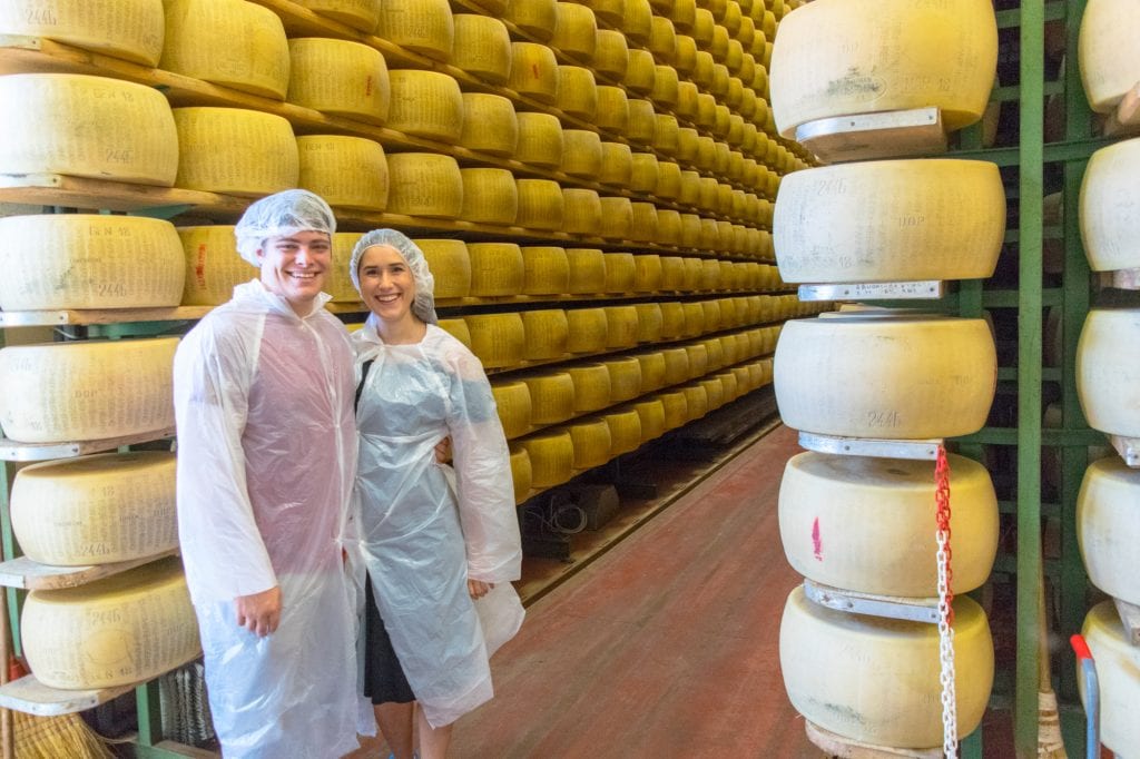 kate storm and jeremy storm touring a parmigiano reggiano factory in parma italy