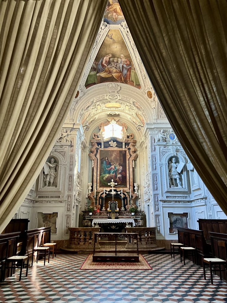 beautiful chapel framed by curtains in the Collegiata di Castell'Arquato castel arquato italy