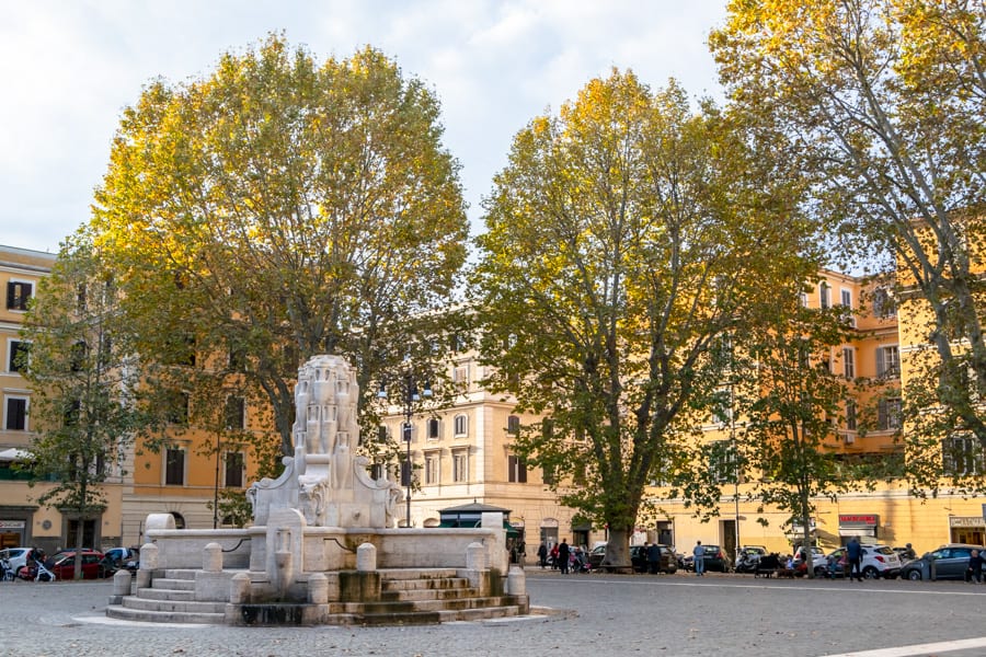 an empty Piazza Testaccio on a fall day with fountain in the center, itinerary rome 4 days