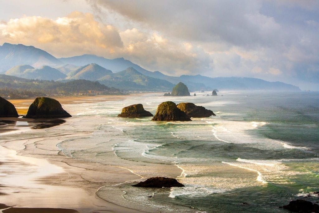 Oregon Coast at sunset looking toward Haystack Rock, one of the prettiest places in Oregon