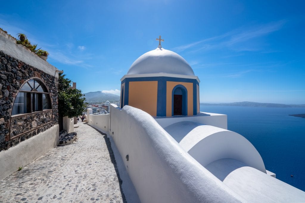 Peach and blue dome with trail on Santorini, 3 days in Santorini itinerary