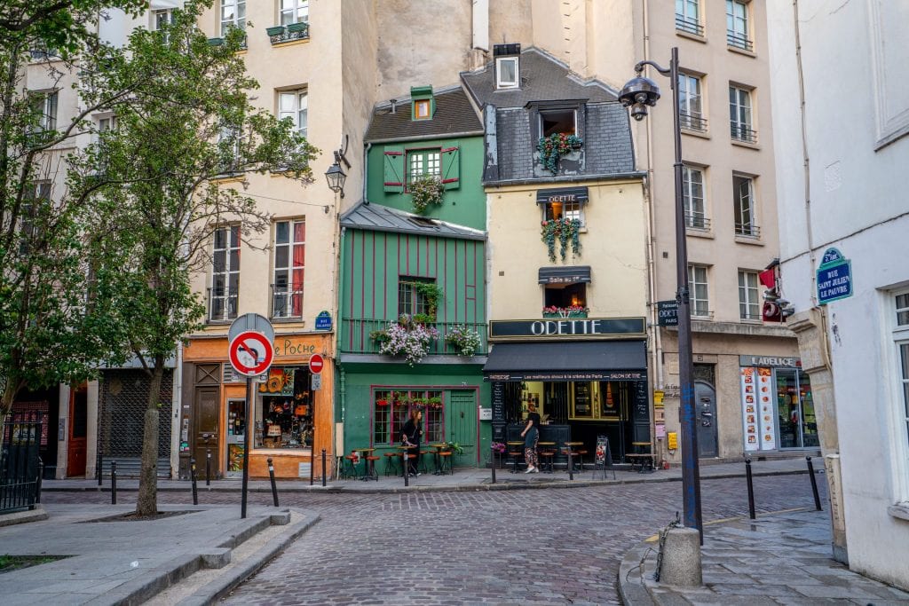Odette Cafe in Paris France with an empty cobblestone street in front of it--not a bad place to grab a coffee during your 2 days in Paris France!