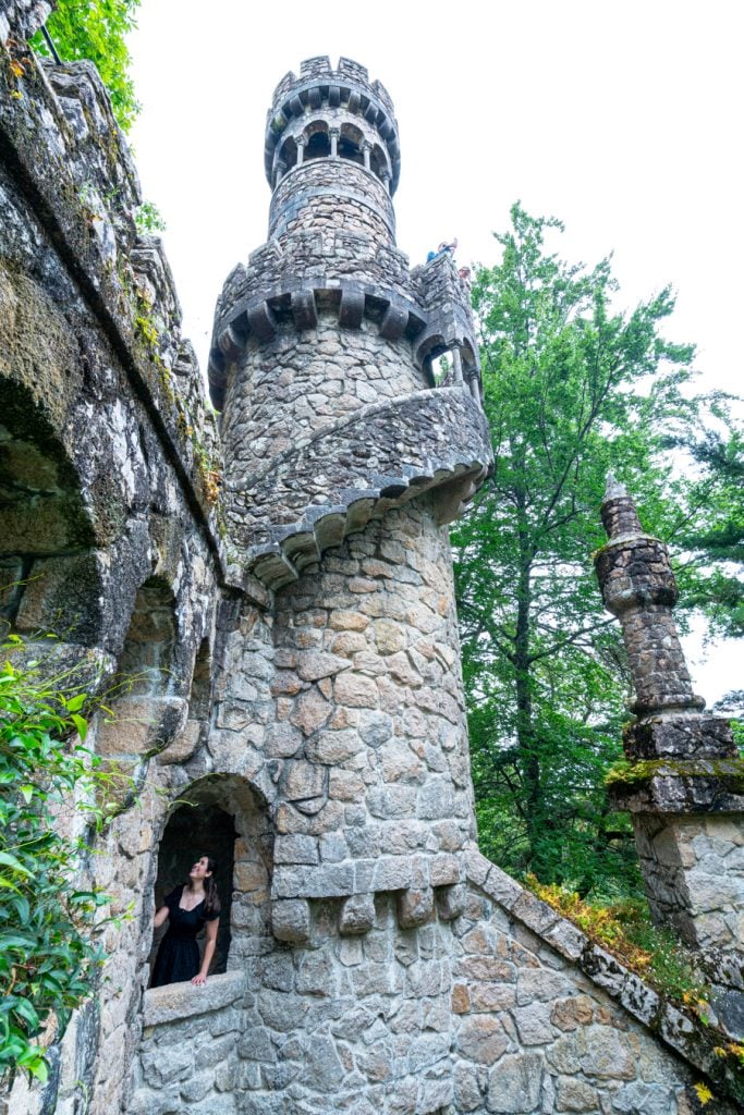 kate storm in stone tower at quinta da regaleira in sintra portugal