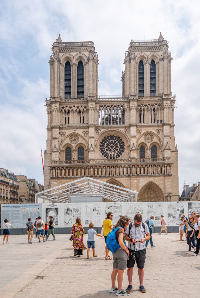 view of the front of notre dame in 2022 with barrier in front