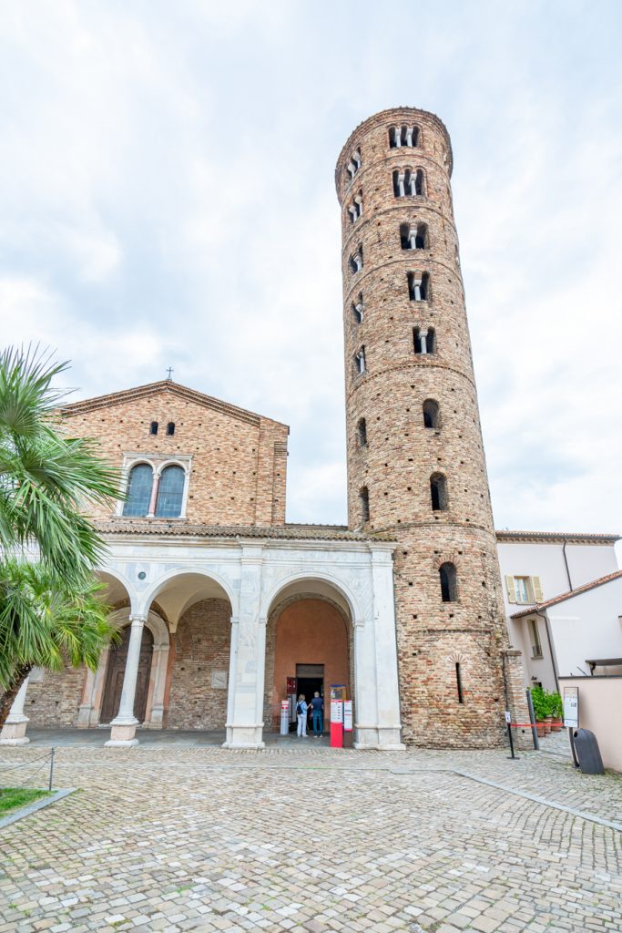 front facade and bell tower of the ravenna italy Basilica of Sant'Apollinare Nuovo on a cloudy day