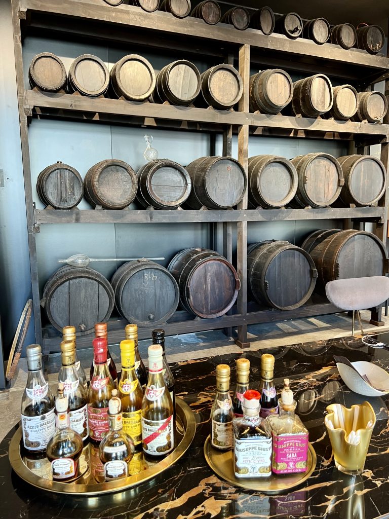 balsamic vinegar shop in modena emilia romagna italy with several bottles set out for tastings